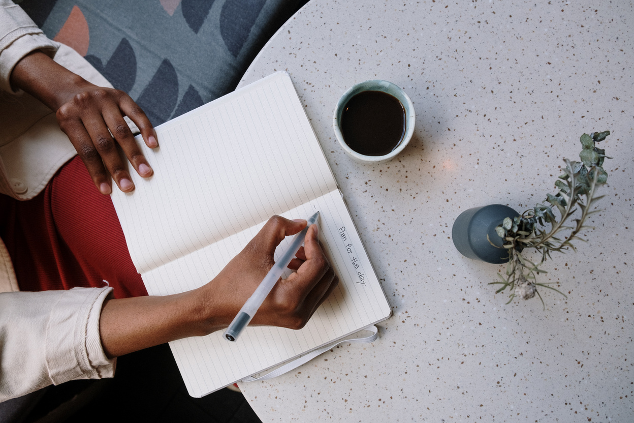 Person Holding White Pen and White Paper