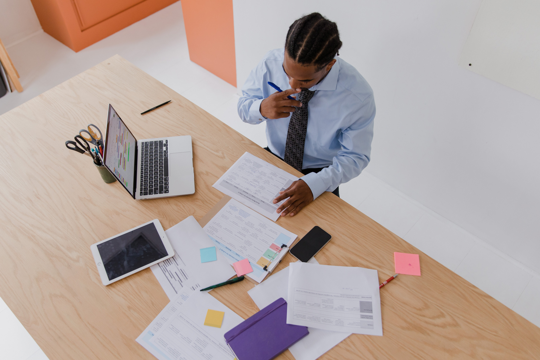 Businessman Working on Papers in Office